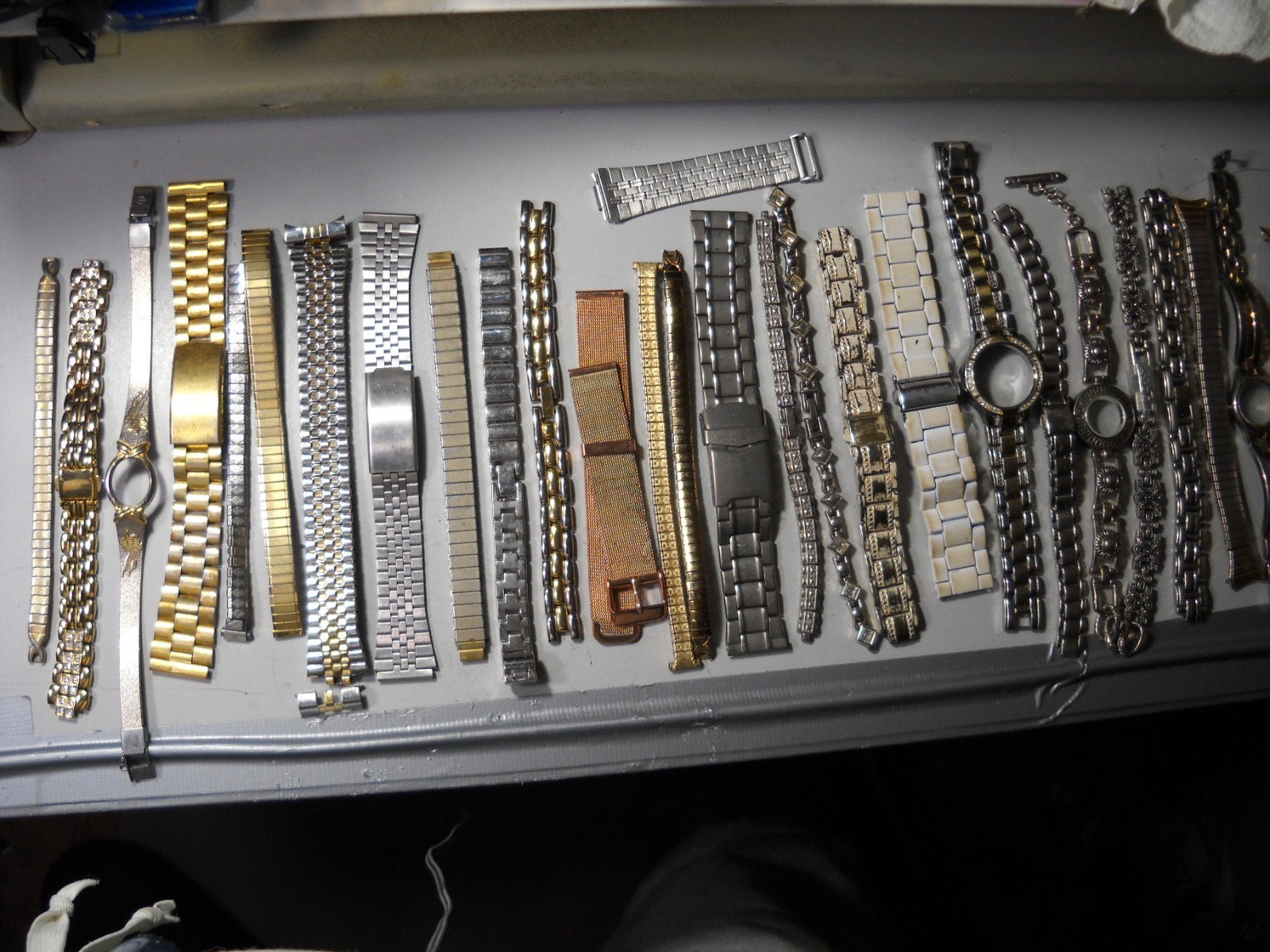 1054L Watch bands 27 piece gold color or plated ? stratch and regular look it