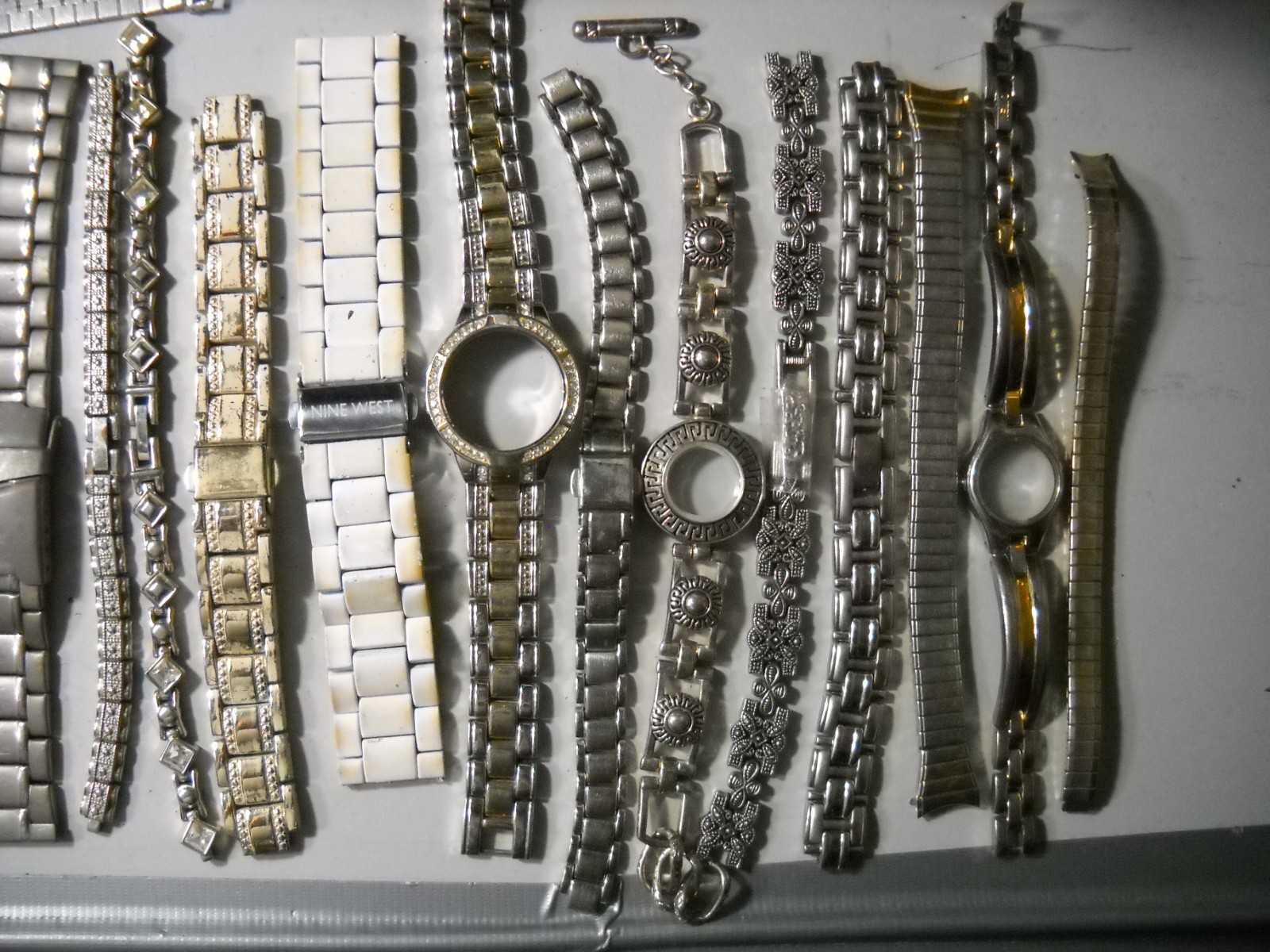 1054L Watch bands 27 piece gold color or plated ? stratch and regular look it