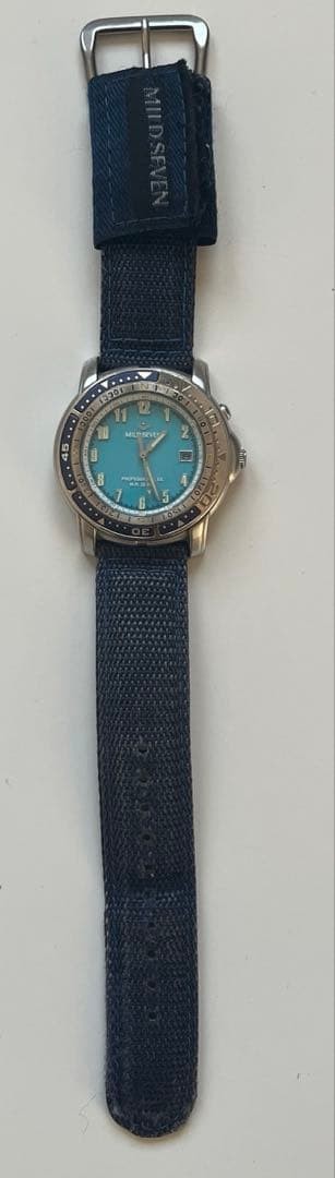 Japanese-made MILD SEVEN quartz wristwatch with backlight, working condition.