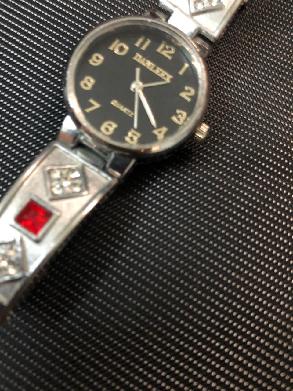 Vintage DANLEEX Womens Quartz Bangle Watch Silver Tone Red Rhinestone Black Dial