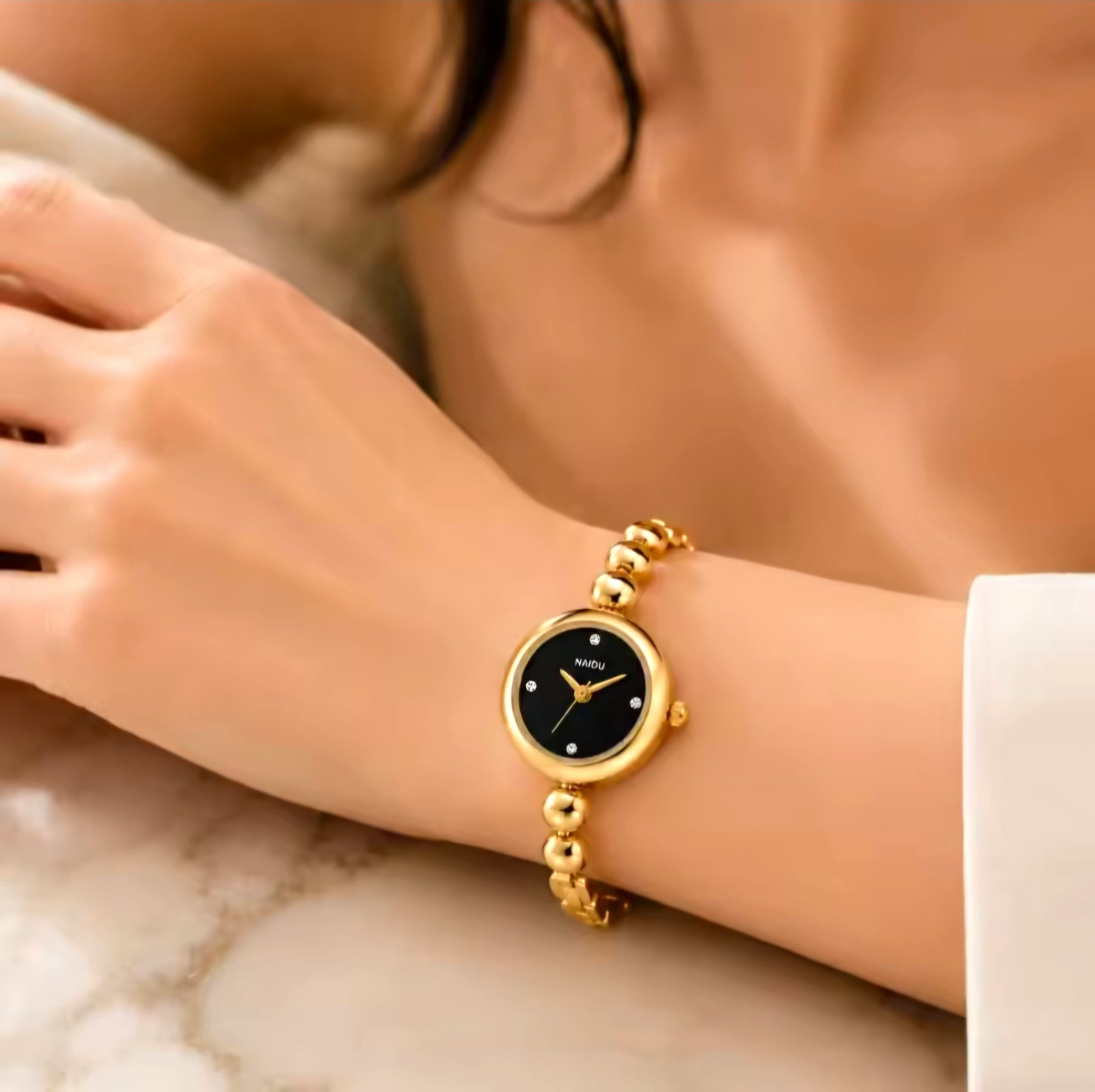 NAIDU Women’s Quartz Analog Gold Tone Metal Bracelet Watch Black Dial Stick