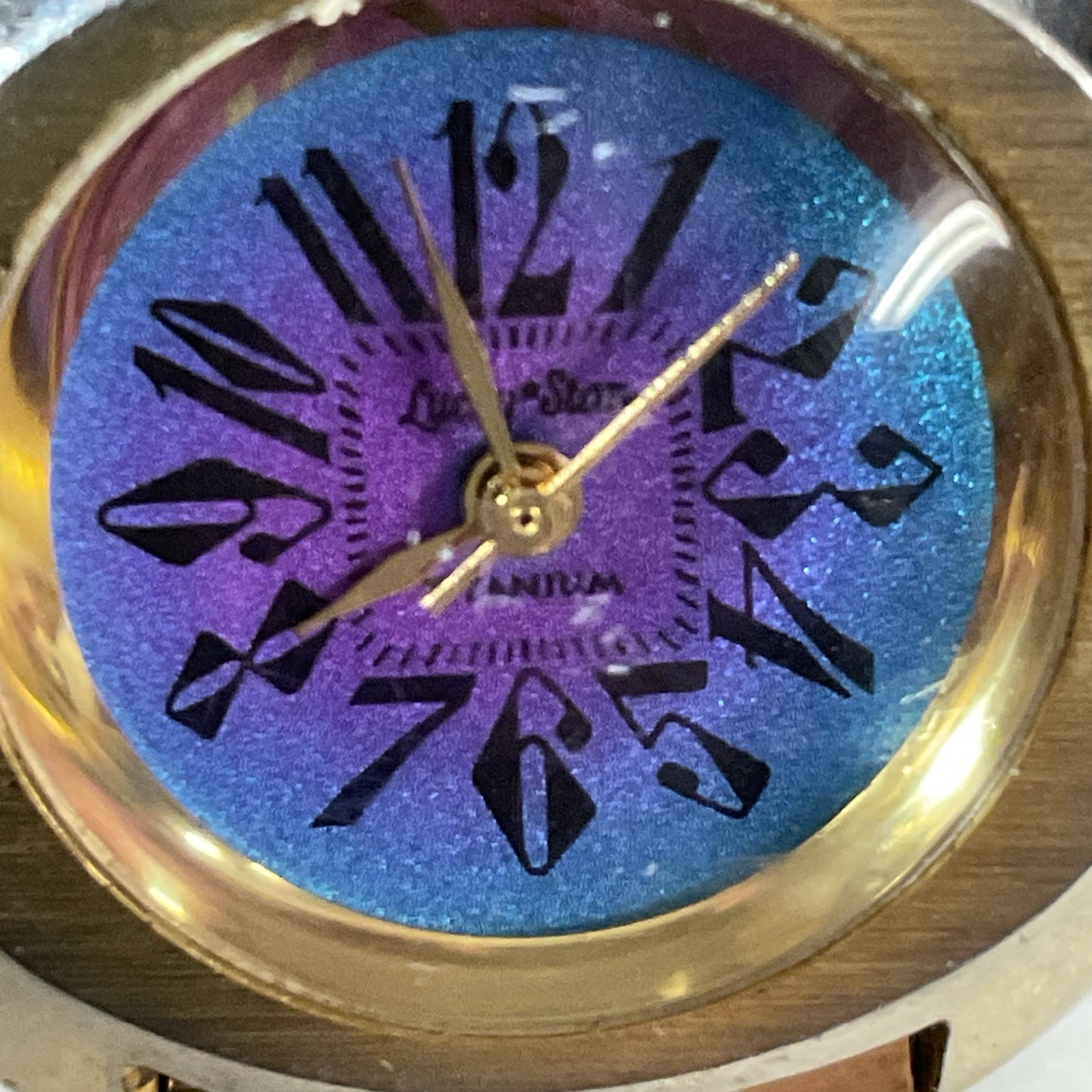 Lucky Star Titanium Purple Face Hold Tone Stretch Band Watch