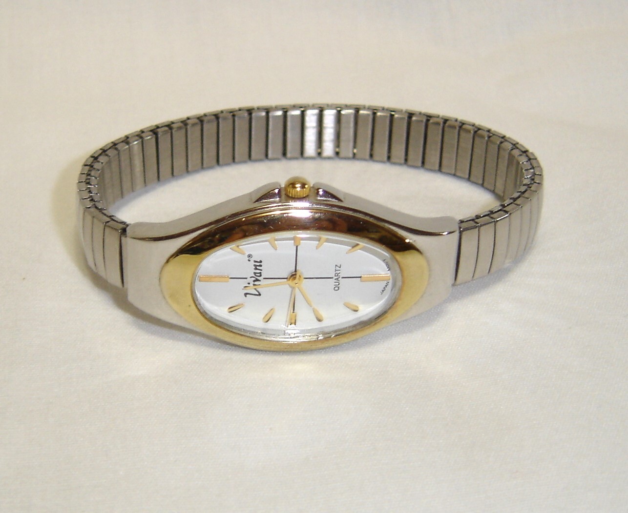 Woman’s Vivani Watch Silver Tone w/ Gold trim / Has A NEW Battery , WORKS Great