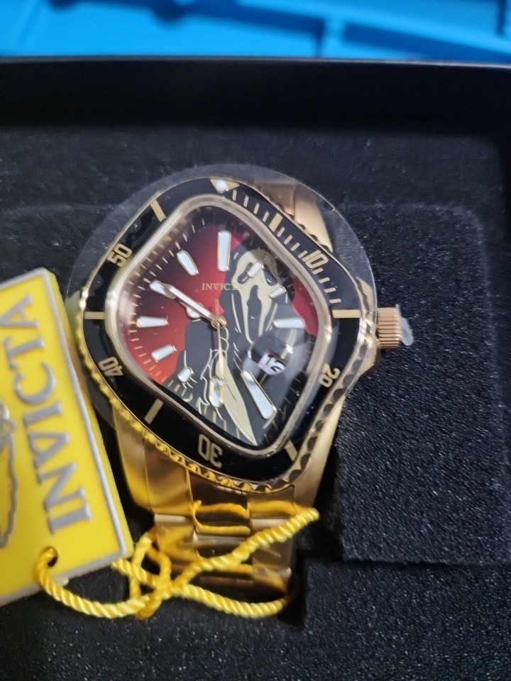 Invicta Artist Surreal Gold Men’s Watch #50546 red/black dial “scream” motif.