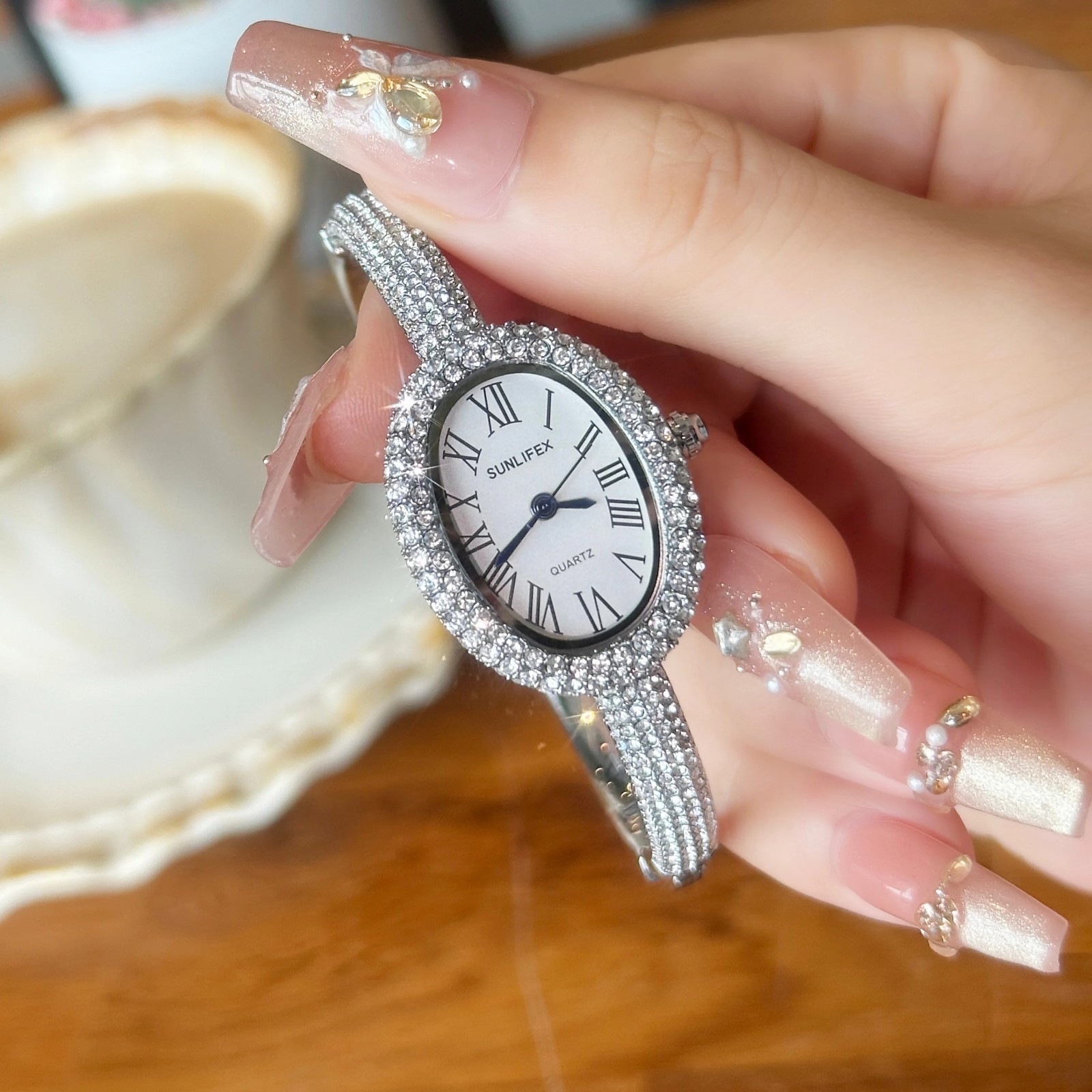 Luxury Crystal Oval Bangle Watch For Women Roman Numeral Dial Rhinestone Inlaid