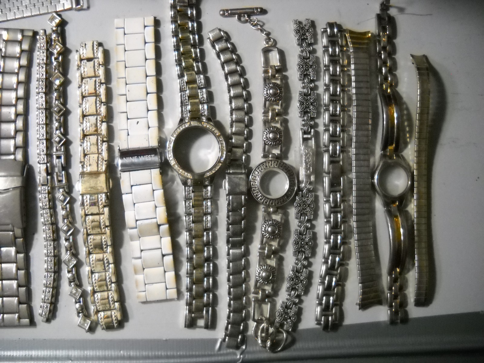 1054L Watch bands 27 piece gold color or plated ? stratch and regular look it